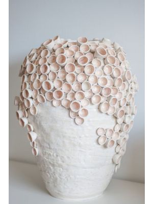 light pink handmade vase with 3D concave details.