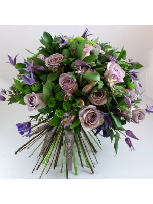 bouquet of Liliac roses and purple Clematis
