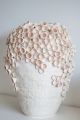 light pink handmade vase with 3D concave details. 